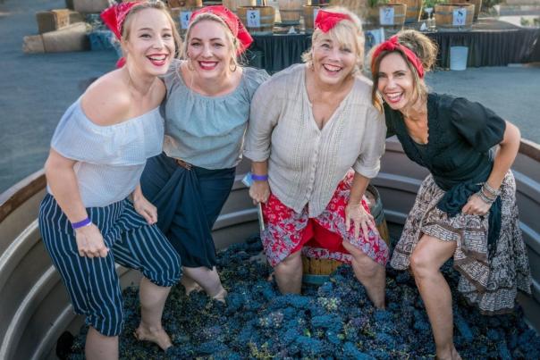 Woman stomping grapes in Temecula winery