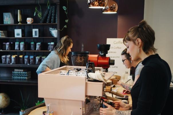 Coffee Wizards cashier serving drinks