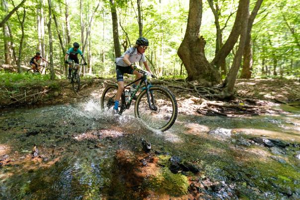 Mountain Biking over a stream