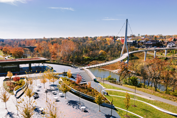 Riverside Crossing Park and the Dublin Link pedestrian bridge surrounded by fall color.