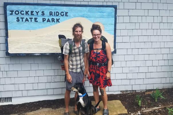 A group of two travelers and their dog along the Mountains to Sea Trail in Johnston County, NC.