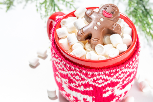 Hot cocoa with marshmallow and gingerbread cookie toppings.