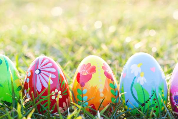 Five painted Easter Eggs on grass