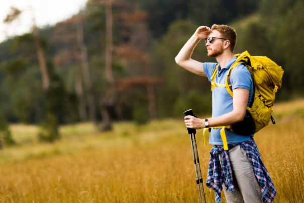 5 Summer Hikes Under Five Miles Blog Cover - Male Hiker Wearing Sunglasses, Looking Out of Frame