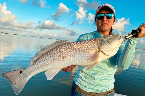 Woman Holding A Large Fish In Corpus Christi, TX