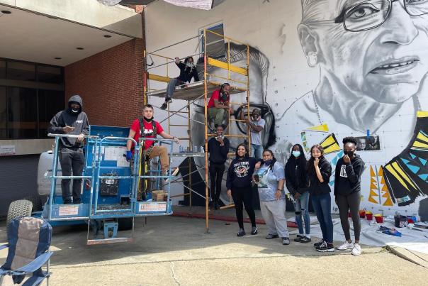 A mural in progress with the Kids making History Mural team.