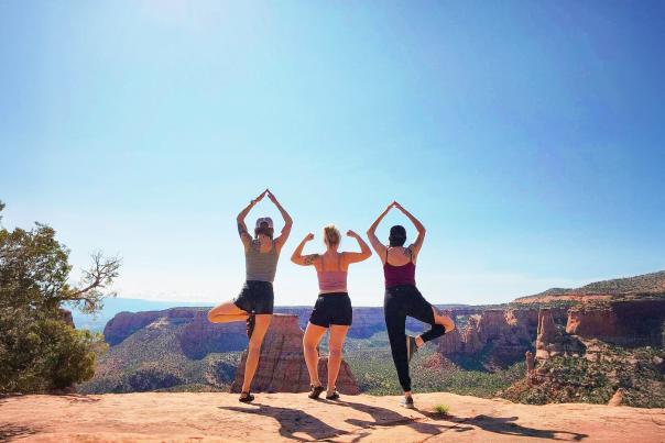Women Posing in front of Colorado National Monument