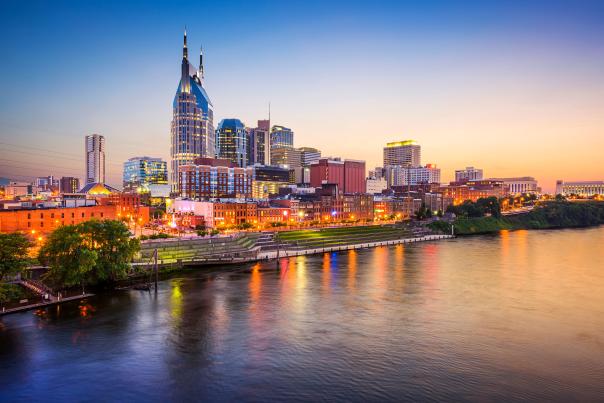 The Nashville skyline along the Cumberland River at sunset.
