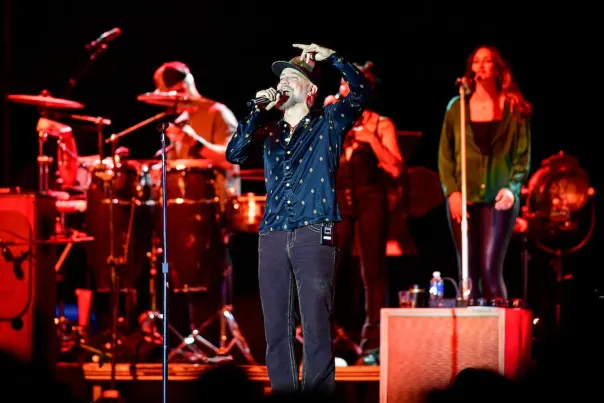 JJ Grey sings into a microphone at the 2025 Helena Old Town Live Concert Series.