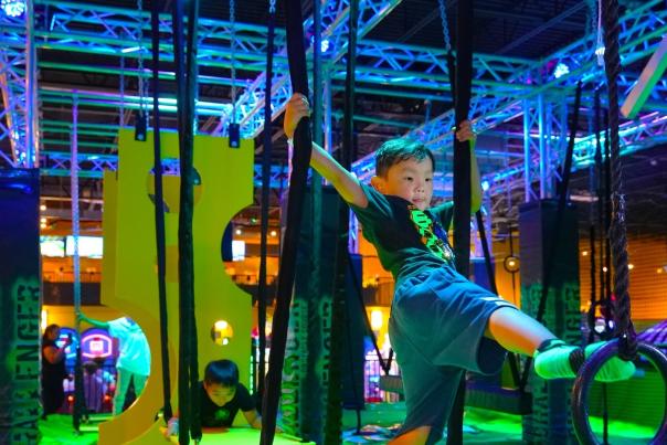 Child playing on obstacle course
