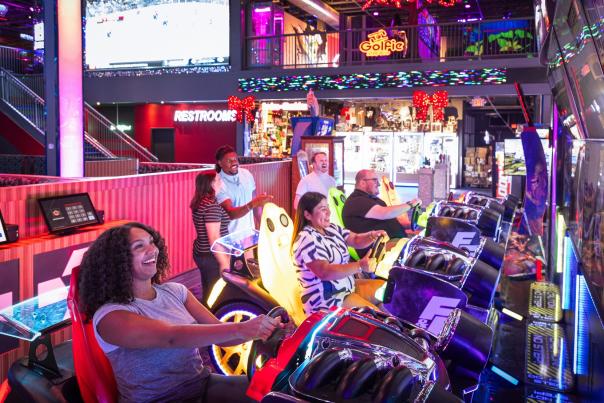 Friends play arcade games at Best in Games