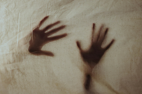 Spooky photograph of haunted-looking hands