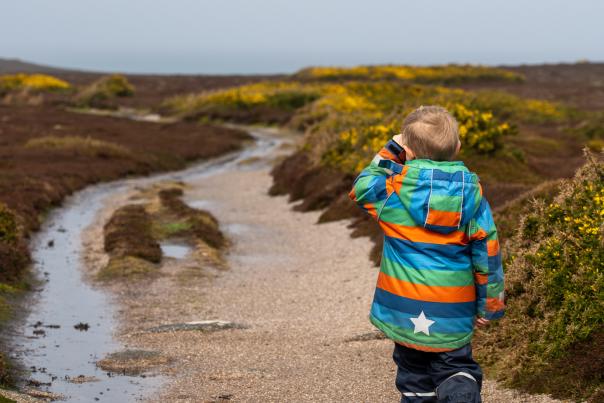 Boy walking in wet weather