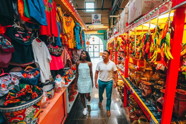 Man and woman walking through aisle at Historic Market Square