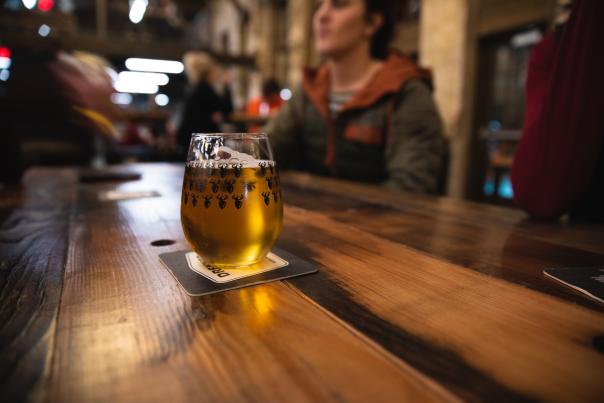pint of beer on wooden table at Brewhalla