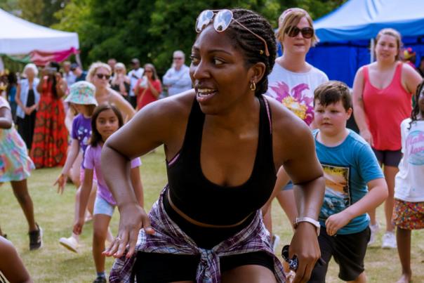 A large group of happy dancers at the Culture Fest event all facing towards the camera