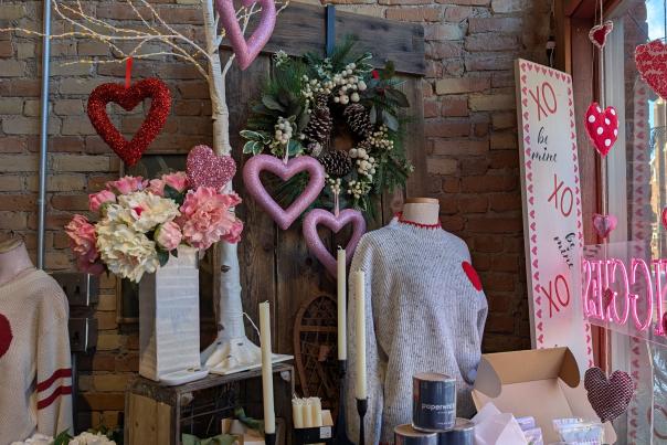 Valentine’s Day gift display at Twiggies in Old Town Lansing featuring flowers, apparel, and seasonal décor.