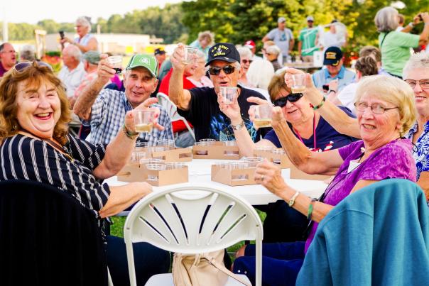 group of senior adults dining outside