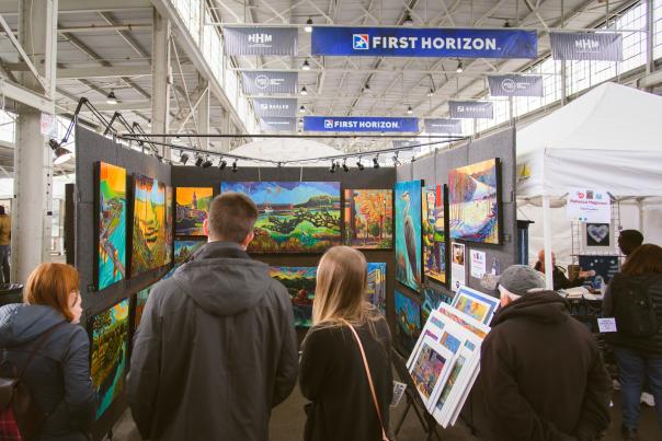 People view art for sale at AVA's 4 bridges Art Festival