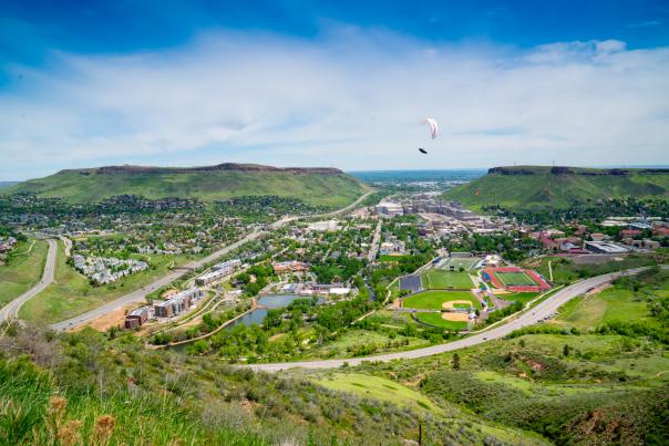 A paraglider in the sky over Golden CO