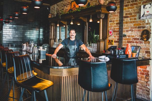 Rob Poses Behind the Bar at Quantum Toad