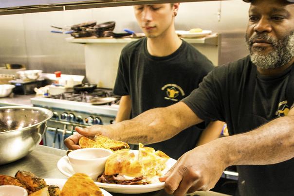 Two chefs plating food at the Clayton Steakhouse in Clayton, NC.
