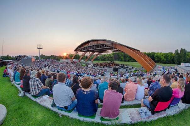 people watching a concert outside at bluestem amphitheater