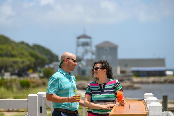 A couple enjoying drinks by the water in Southport NC