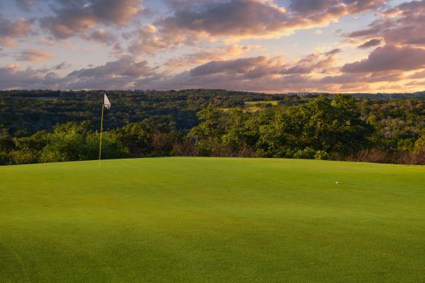 Golf course with dusk in background