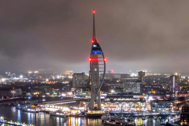 A nighttime shot of the Spinnaker Tower and surrounds looking wintry