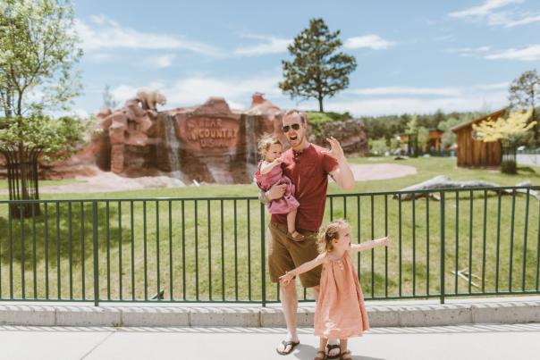 family roaring like bears at the bear country usa attraction in rapid city, sd