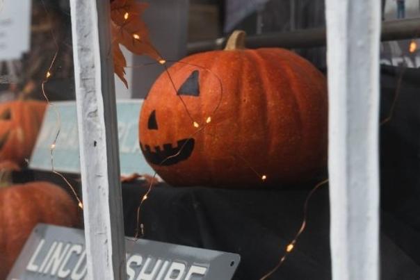 Carved pumpkins on display in a shop window in Lincoln