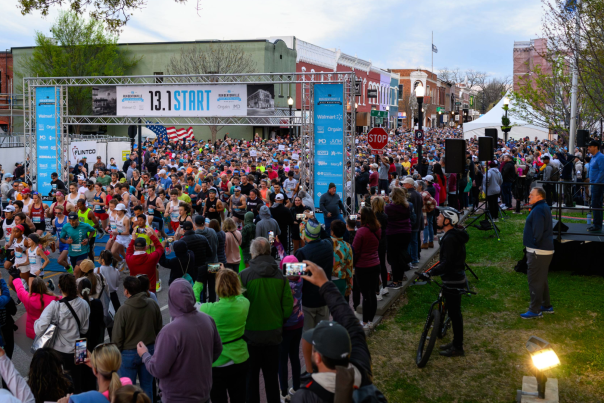 Runners gather at the starting line of the Bentonville Half Marathon in downtown Bentonville.