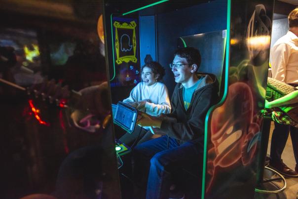 kids playing arcade games at press start in downtown rapid city, sd