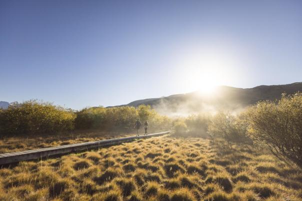 Two people walking the Glenorchy Lagoon Walkway in the morning