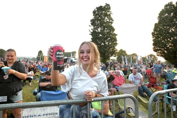 The Morgan County Pre-Fair Concert takes place on June 13 this year featuring several country music performers at the Morgan County Fair. A spectator toasts the camera with a happy smile and a locally crafted beer from Cedar Creek Brew Co.

Photo Credit: Scott Wallace