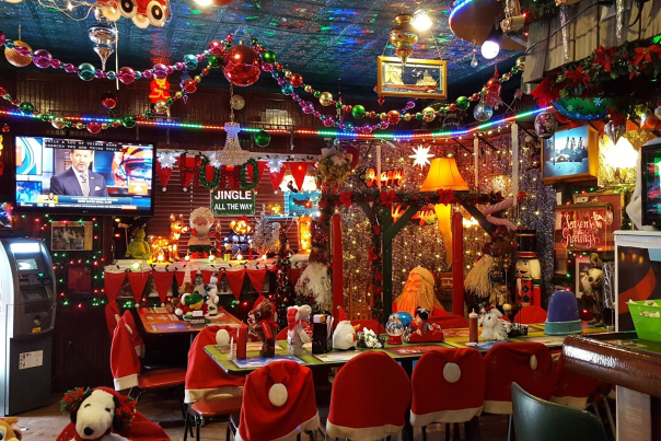 Interior of dive bar filled with Christmas decorations