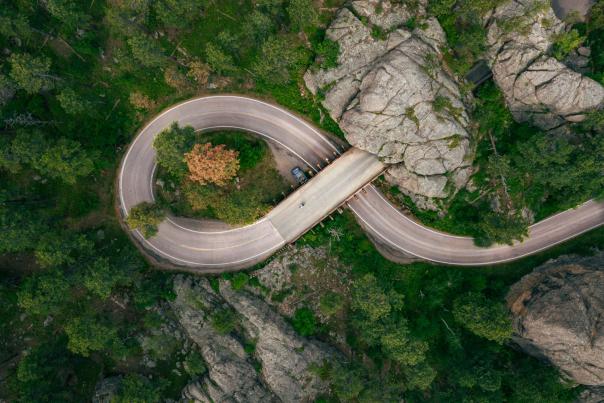 Drone shot above the pigtail and mountain tunnel of iron mountain road in the black hills