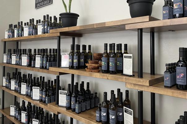 Rack of olive oil at On the Surface