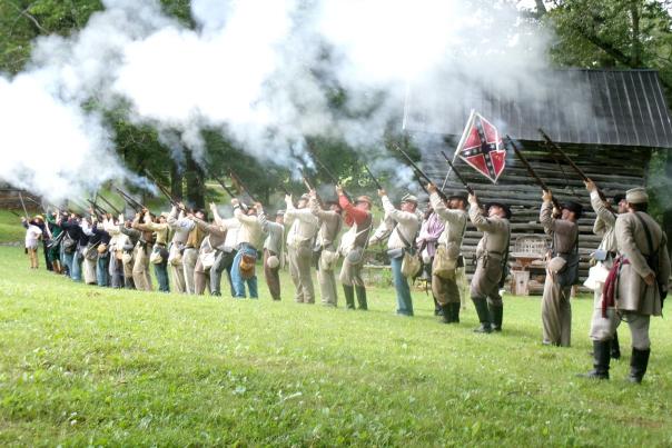 Civil War Reenactors fire their rifles during a historic demonstration