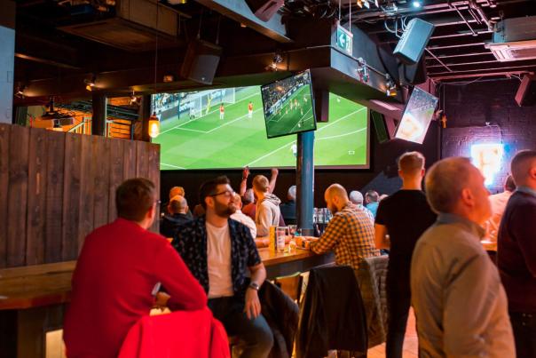 Groups of people watching sport at Franklin's Sports Bar.