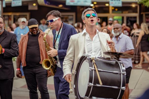 Photo featuring the River City Brass Band at the Brass on Mass street party in 2025.