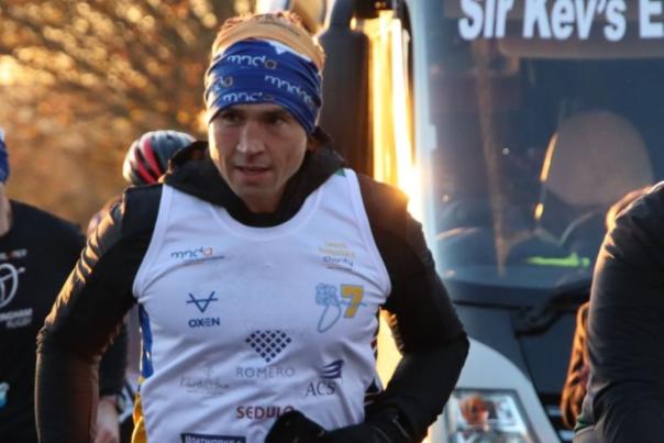 Kevin Sinfield runs alongside others during a marathon
