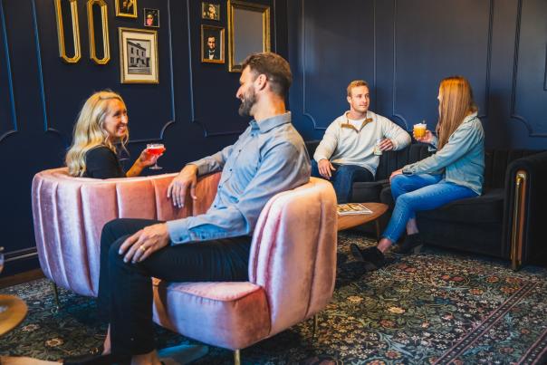 People Sitting in Lobby at Hotel Melrose