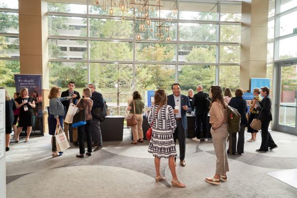 People talking at a conference in The Woodlands, Texas