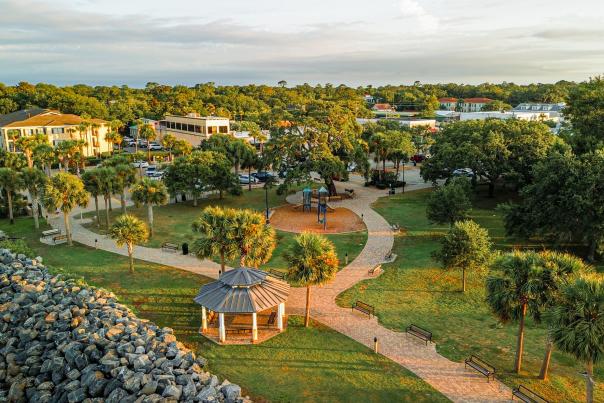 An aerial view of Neptune Park and Pier Village on St. Simons Island, GA.