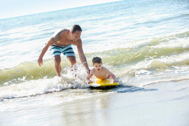 Dad and Son on a Boogie Board at The Beach, Visit Myrtle Beach, SC