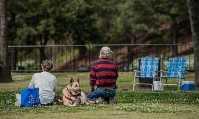 Family and dog enjoying a picnic