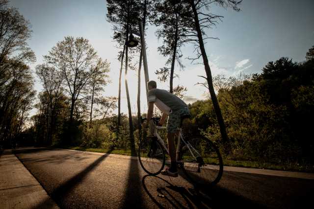 Man Biking in River Prairie Park In Eau Claire, WI