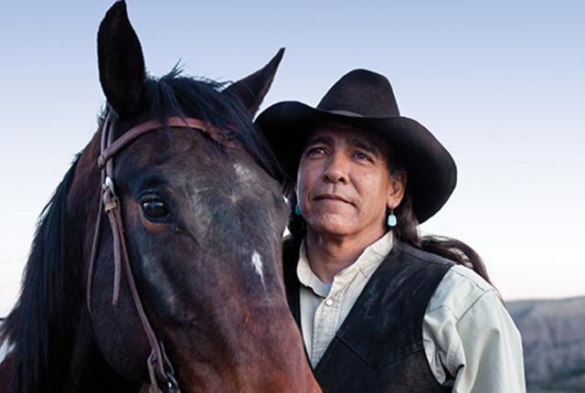 Joe Saenz, the top guide in Southern New Mexico, holds a loose rein on one of the horses he raised from a colt.